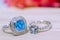 Two blue gemstone rings placed on beautiful wooden floors Natural blue Topaz