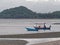 Two blue and orange fishing boat with light pole to catch squid and cuttlefish at Khao Lom Muak, Ao Manao