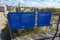 Two blue signs with white text that post the rules and regulations for the beech and boardwalk