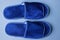 Two blue slippers made of fabric