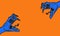 two blue snake heads hissing at each other from opposite corners of orange background