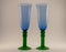 Two blue wine glasses with green bottom stands