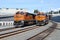 Two BNSF freight trains waiting on a curve