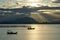 Two boat under the sunray at sea.