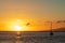 Two boats anchored in the Pacific Ocean during a beautiful, bright sunset