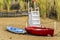 Two boats and lifeguard chair on a beach of panarea island