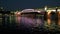 Two boats sail under the bridge in evening Moscow.