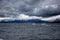two boats sailing before landscape of Patagonian mountains, taken from the beagle channe. Ushuaia, patagonia