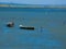 Two boats on a small part of the Mediterranean Sea protected from the waves by a tongue of land towards Port-Saint-Louis-du-RhÃ´ne