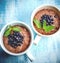 Two boils with Chia seed pudding with berries and carob