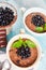 Two boils with Chia seed pudding with berries and carob
