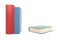 Two books red and blue standing and a blue book lying down on a white background