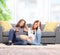 Two bored teenage girls watching TV