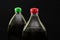 Two bottles of carbonated drink on a wooden background. Close-up. Top of bottles with cap.