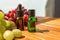 two bottles of essential oils. natural cosmetics for skin care. A bottle and fresh peaches and grapes on a wooden table