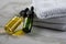 Two bottles of green natural serum and yellow organic beauty face oil for cosmetic anti age treatment skin care on towels and