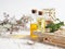 Two bottles of oil, skin care, aromatherapy, stand on a wooden stand, dried flowers