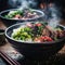 two bowls filled with rice vegetables and meat