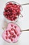 Two bowls of fresh raspberry foam desert
