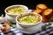 Two bowls hold a savory treasure French onion soup with melted cheese