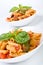 Two bowls of mediterranean pasta