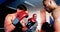 Two boxers fighting in boxing ring