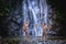 Two boy laugh fishing at a waterfall countryside thailand.Fishing boy asian by gaff in creek with beautiful background