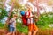 Two boys with backpacks on the hike in forest