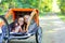 Two Boys in Bike Trailer Outside