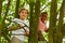 Two boys climbing tree