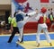 Two boys contest in a Taekwondo competiton