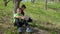 Two boys discusses school homework sitting under the tree in park