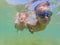 Two boys dive in swimming goggles in the sea