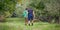 Two Boys Exploring in an Apple Orchard