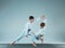 The two boys fighting at Aikido training in martial arts school. Healthy lifestyle and sports concept