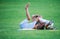 Two boys fighting outdoors. Siblings wrestling on grass in park