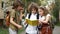 Two boys and a girl, teenagers, school children, discuss a book on the way from school. The girl saw the bumblebee and