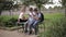 Two boys and girl use their phones during school breack. Cute boys sitting on the bench and play online games