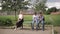 Two boys and girl use their phones during school breack. Cute boys sitting on the bench and play online games