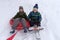 Two boys go snow sledding and tubing