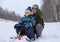 Two boys go snow sledding and tubing