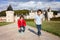 Two boys, happily playing after the rain on the driveway of French Gizeux castle