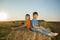 Two boys in a haystack in the field