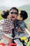 Two boys kissing their father\'s cheeks