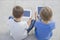 Two boys looking at tablet pc. Childhood, education, learning, technology, leisure concept