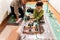 Two boys play with robots that they created from the robotic constructor on the colorful banner on the floor in the