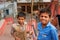 Two boys play on the the street after school