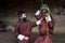 Two boys play with terrifying mask of mask dance , Bumthang, central Bhutan.