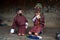 Two boys play with terrifying mask of mask dance , Bumthang, central Bhutan.