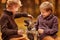Two boys playing with a puppy